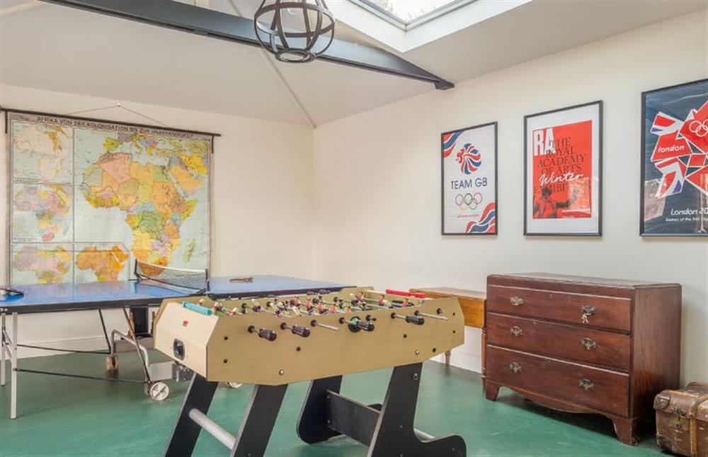 The games room has table football and table tennis  at Holt Coach House, Sudbury