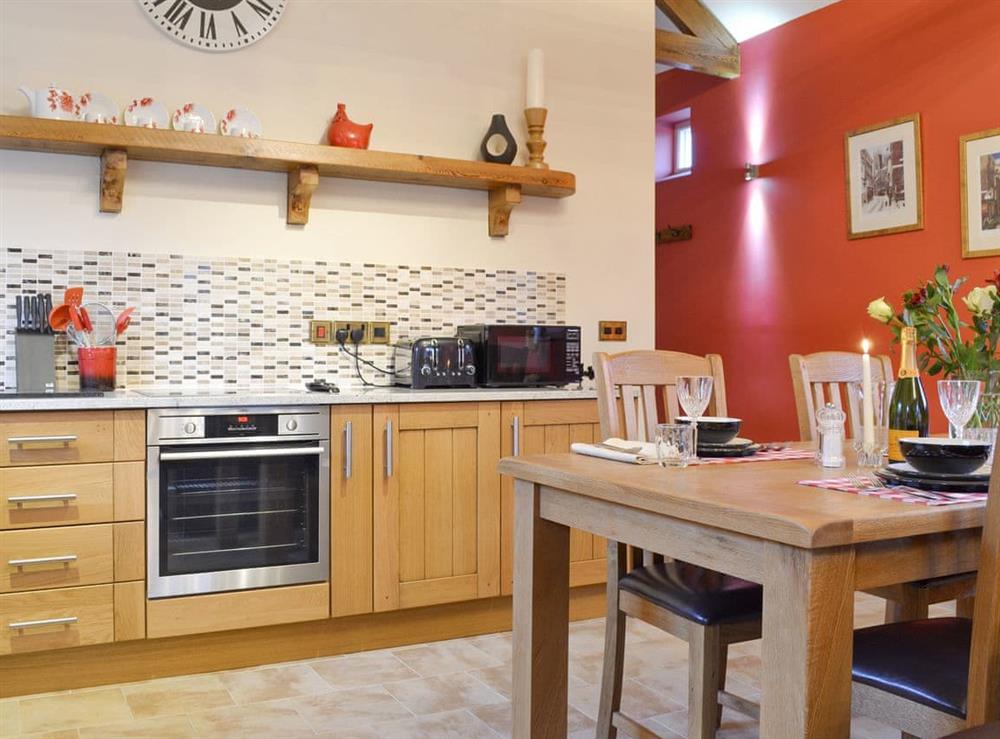 Well-equipped fitted kitchen at Owl Cottage, 