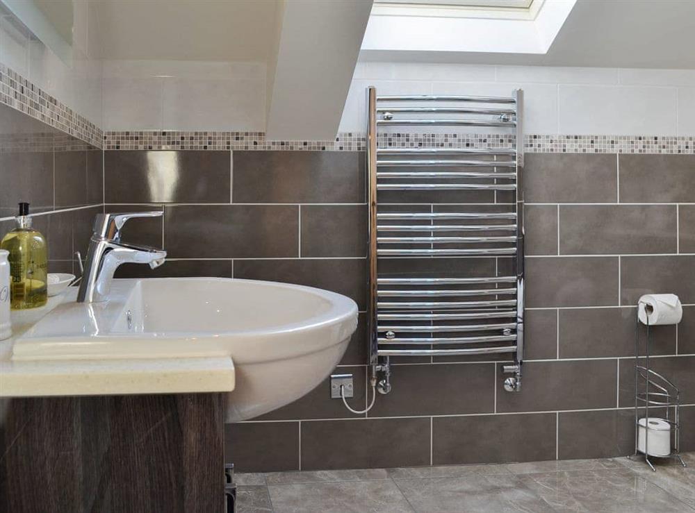 Wonderful tiled bathroom with heated towel rail at The Granary, 