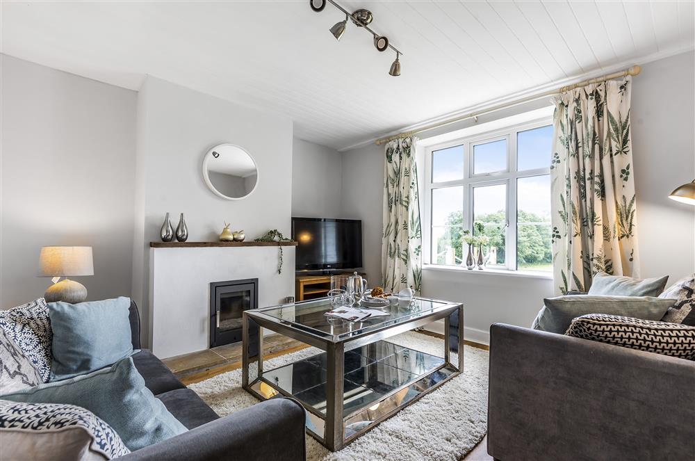 Ground floor: Sitting room with comfortable seating at Holway Cottage, Cattistock