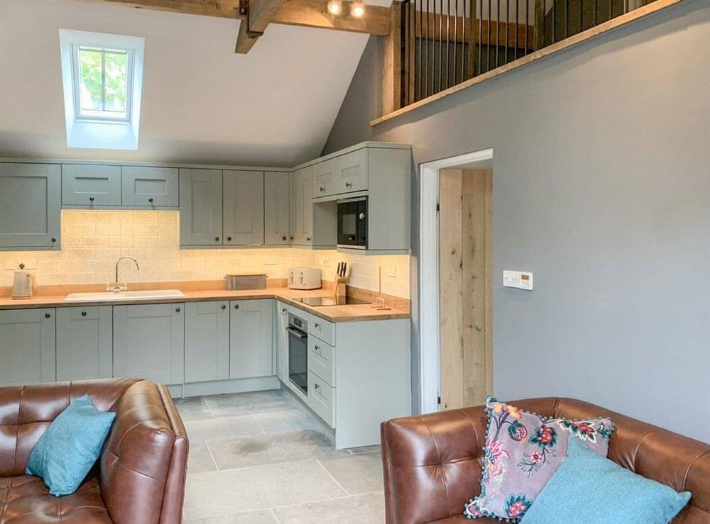 Open plan living space at Holyoake Farm Barns- The Milking Shed in Little Alne, near Wootton Wawen, Warwickshire