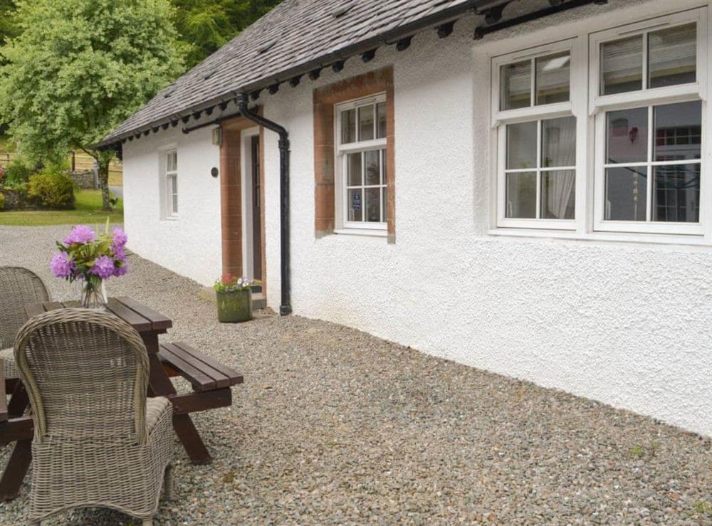 Appealing holiday home with outdoor furniture on gravelled patio area at The Stables, 