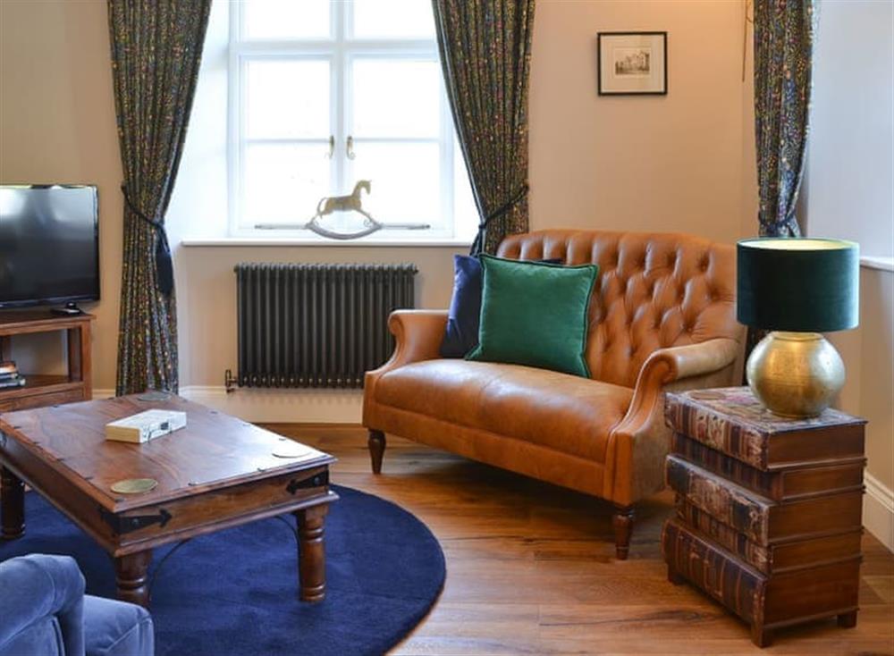 Cosy living room with wood burner (photo 3) at Home Cottage in Barbrook, near Lynton, Devon