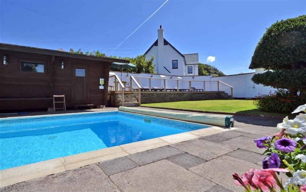 The fabulous swimming pool and sun deck at Home Cottage in Thurlestone