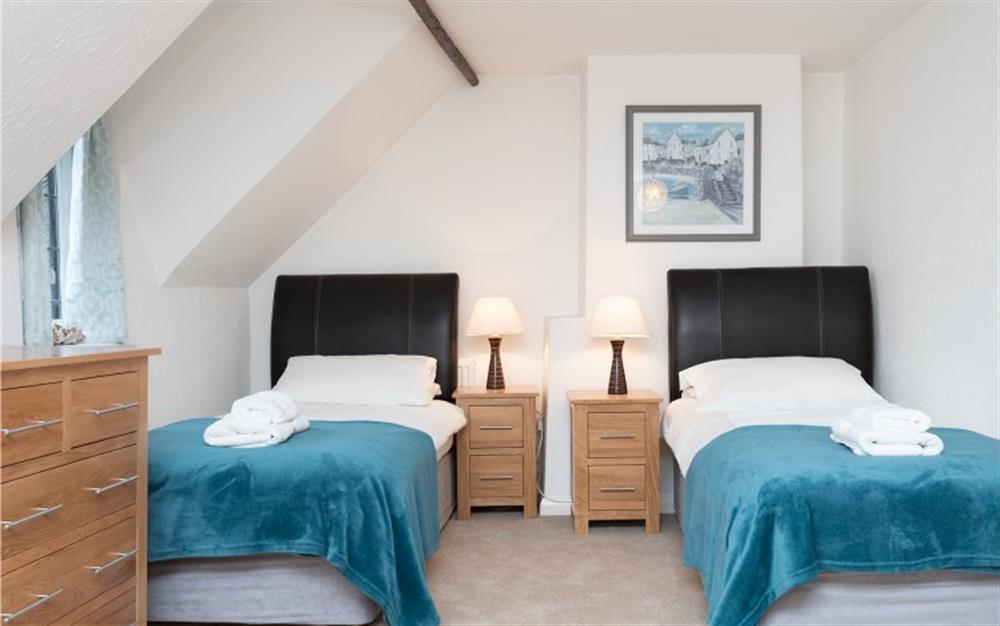 Twin beds in the triple room  at Home Cottage in Thurlestone