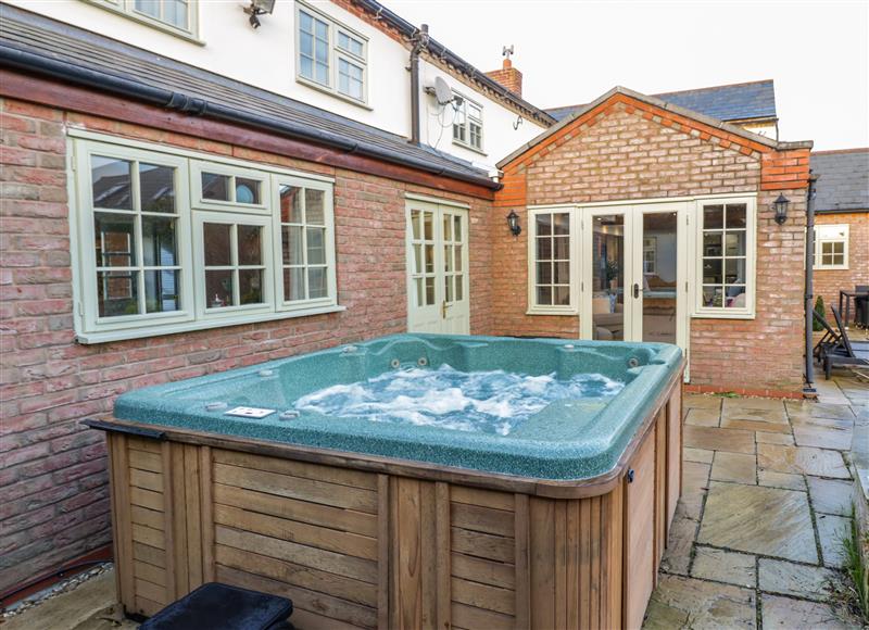 Relax in the hot tub at Home Farm Cottage, Stockton near Napton-On-The-Hill