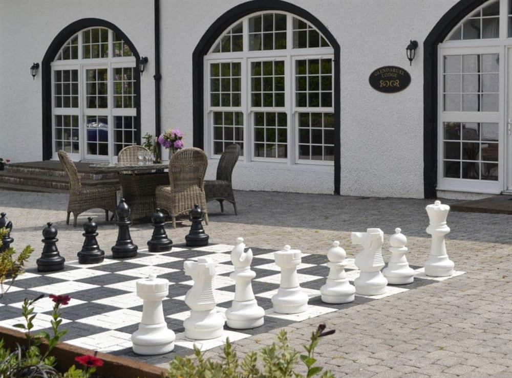 Patio area with oversized chess game at Glendaruel Lodge, 