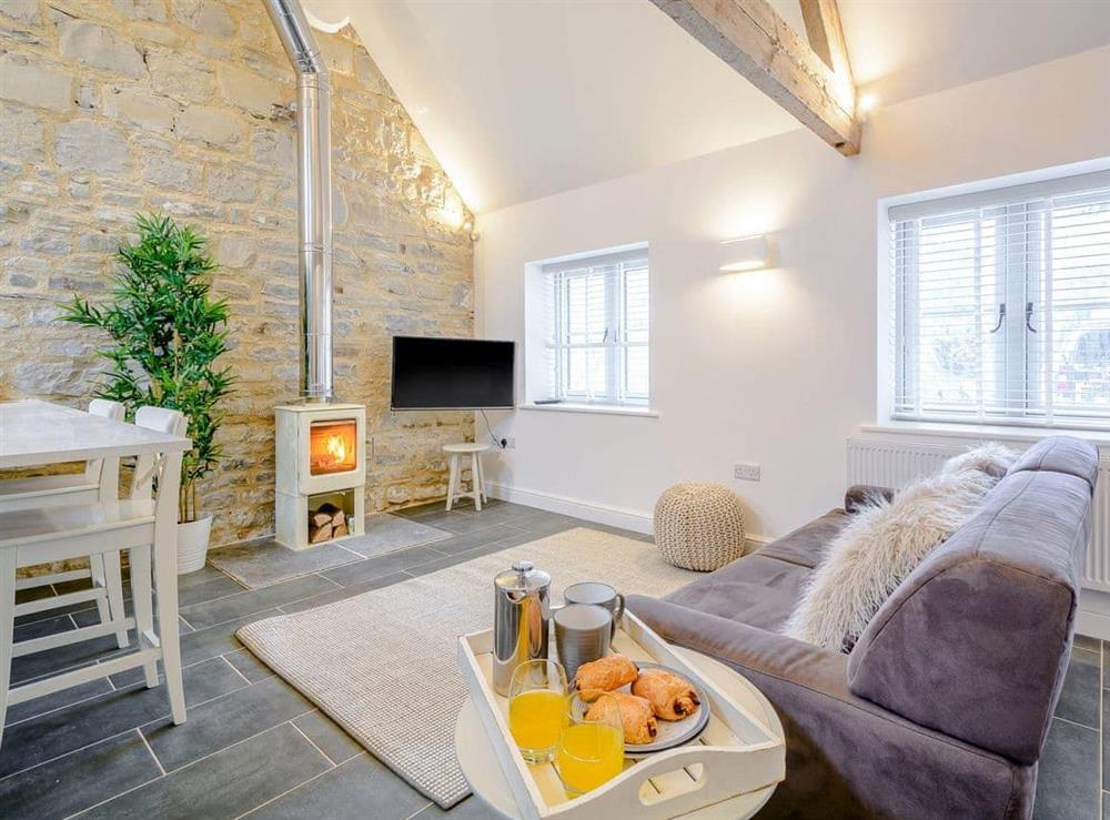 Charming living area with cosy wood burner at Pippin, 