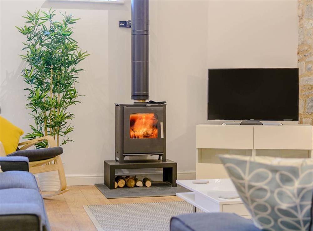 Cosy and warming woodburner in the living room at Russett, 