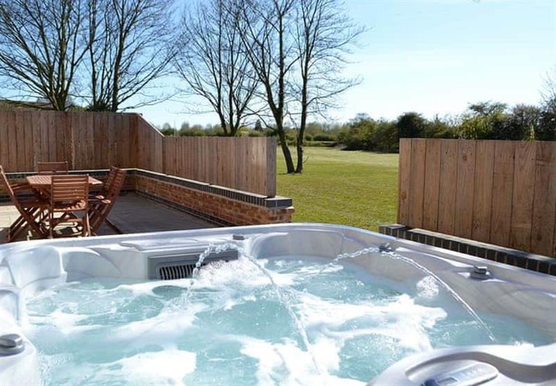 Hot tub in The Farmhouse at Home Farm Park Luxury Barns in Burgh le Marsh, Lincolnshire