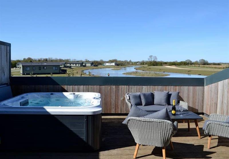 Hot tub on the decking in Rosemary Cottage at Home Farm Park Luxury Barns in Burgh le Marsh, Lincolnshire