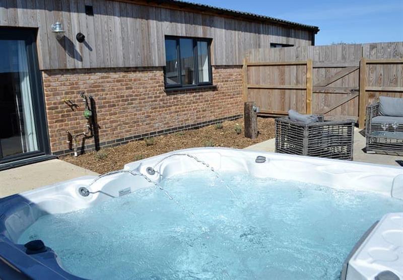 Hot tub outside Lavender at Home Farm Park Luxury Barns in Burgh le Marsh, Lincolnshire