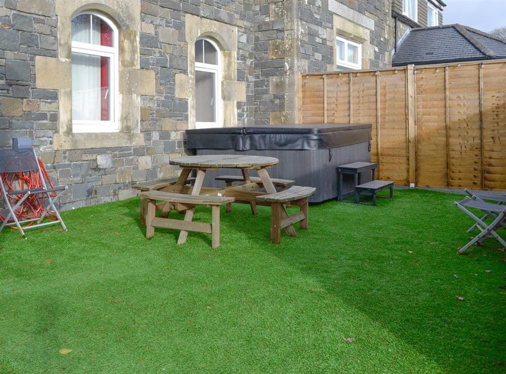 Outdoor area with hot tub at Home Farm in Stranraer, Wigtownshire