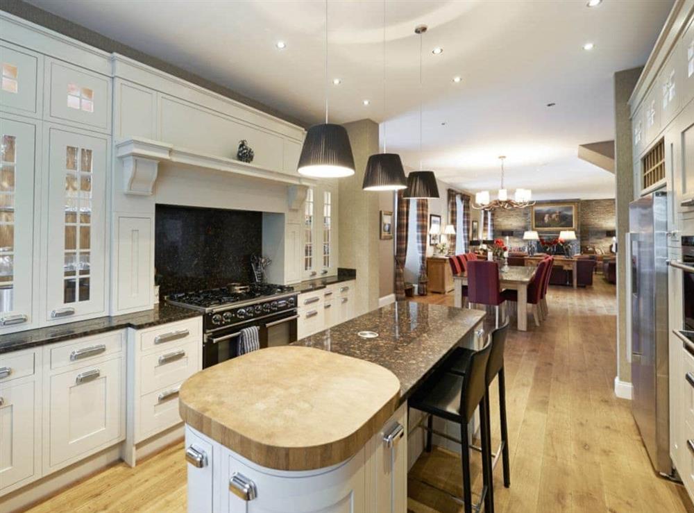 Excellent kitchen looking through to the open plan dining and living area at The Coach House, 