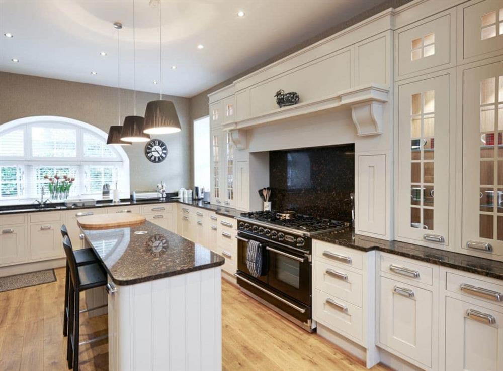 Magnificent well-equipped kitchen with gas range at The Coach House, 