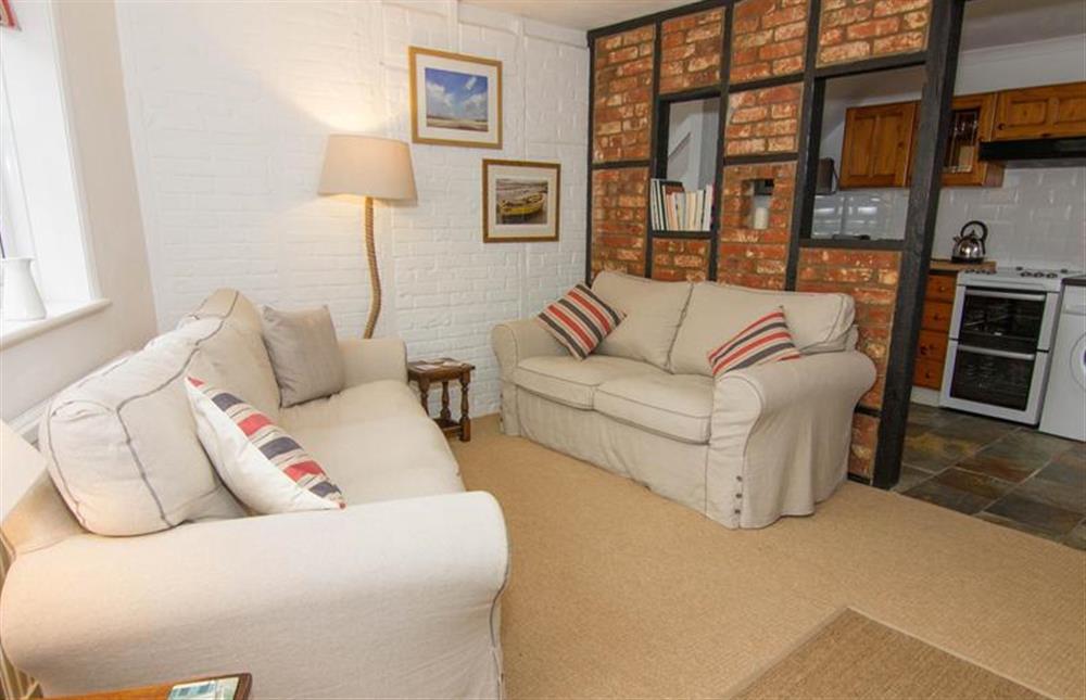 Ground floor: Sitting room with feature brick wall at Home Lea, Docking near Kings Lynn