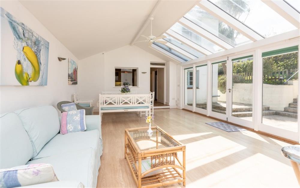 The large conservatory with games room and dining area at Homelands in Dittisham