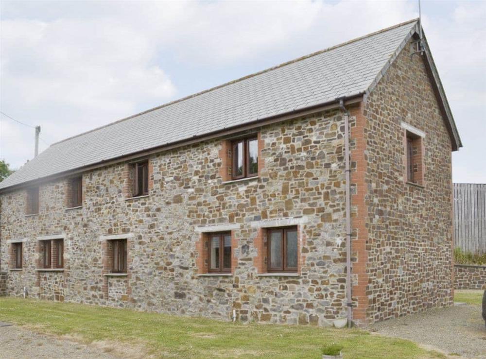 Rear of the stone-built barn conversion at Homeleigh Barn in Poundstock, Bude, Cornwall