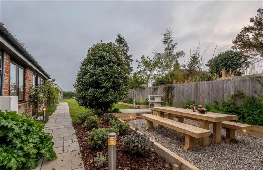 Al fresco dining with a chiminea and a plinth for a disposable barbecue