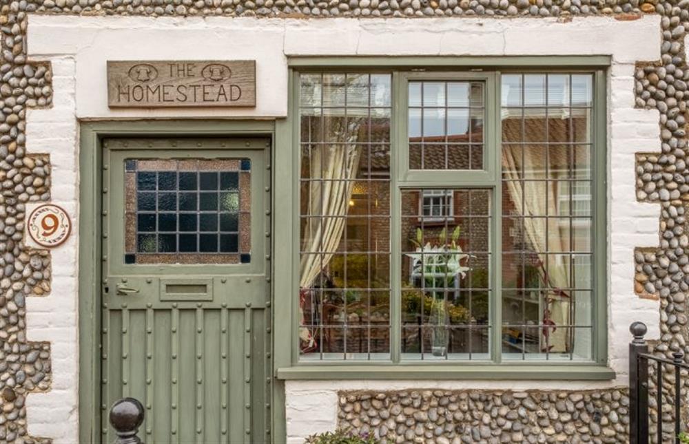 Front door showing the mullion windows