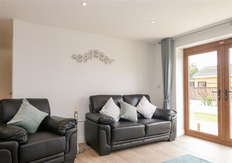 Relax in the living area at Honey Bee Retreat, Tytherleigh