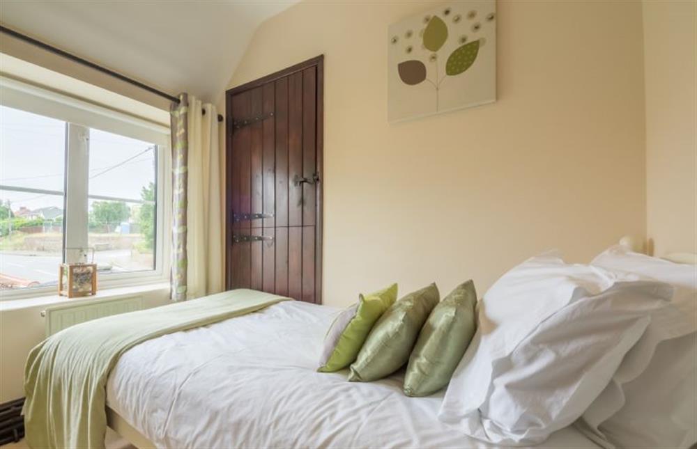 First floor: Bedroom three, full sized single bed at Honey Cottage, Sedgeford near Hunstanton