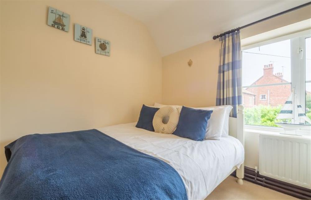 First floor: Bedroom two, with double bed at Honey Cottage, Sedgeford near Hunstanton