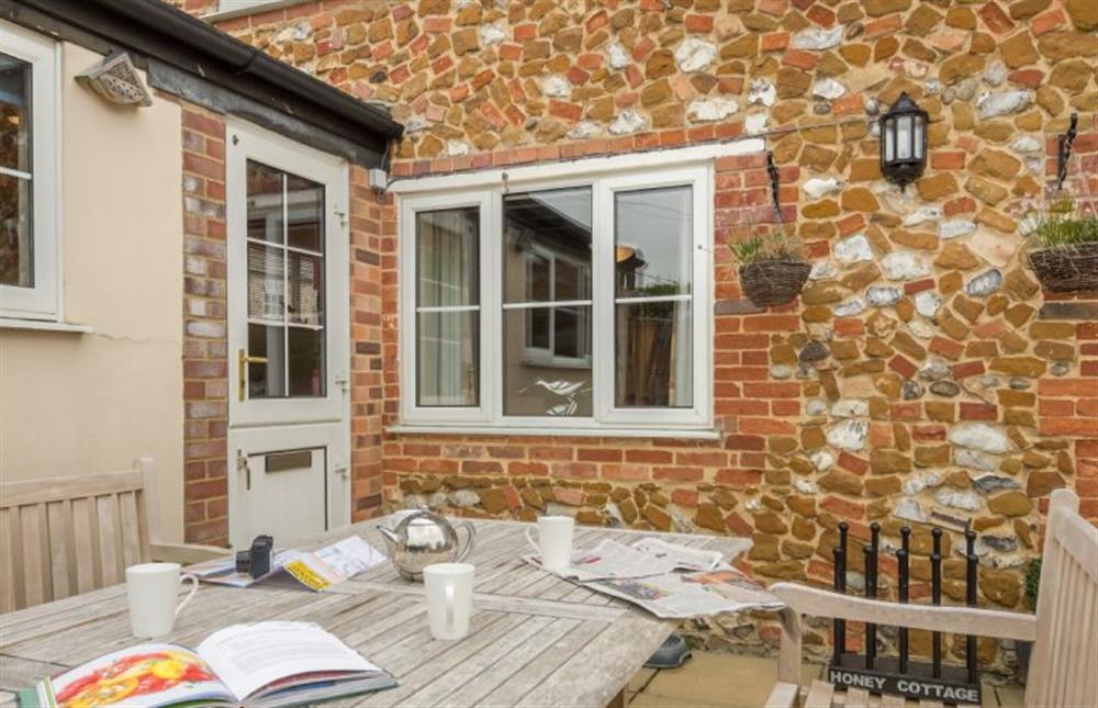 Large table on the sheltered patio at Honey Cottage, Sedgeford near Hunstanton