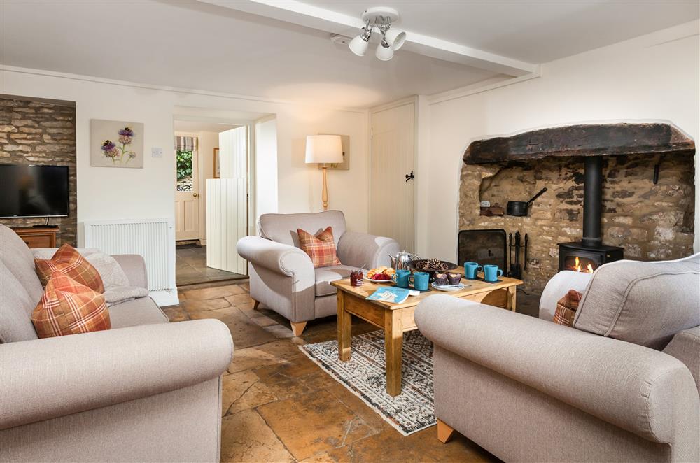 The sitting room boasts exposed brickwork