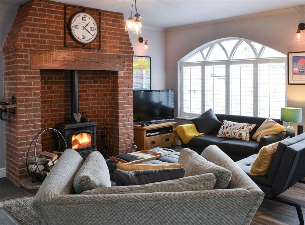 Lounge area with wood burning stove at Honey Pot Cottage in near Rothbury, Lancashire