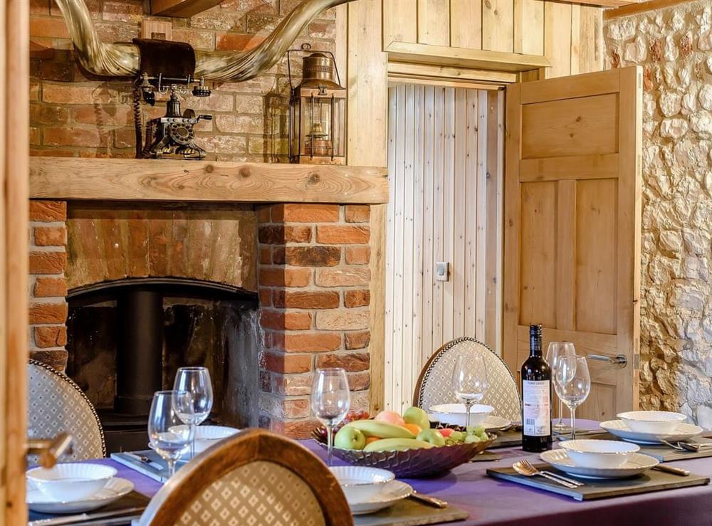 Formal dining room with wood burner (photo 2) at Honey Potts in Foulden, near Swaffham, Norfolk