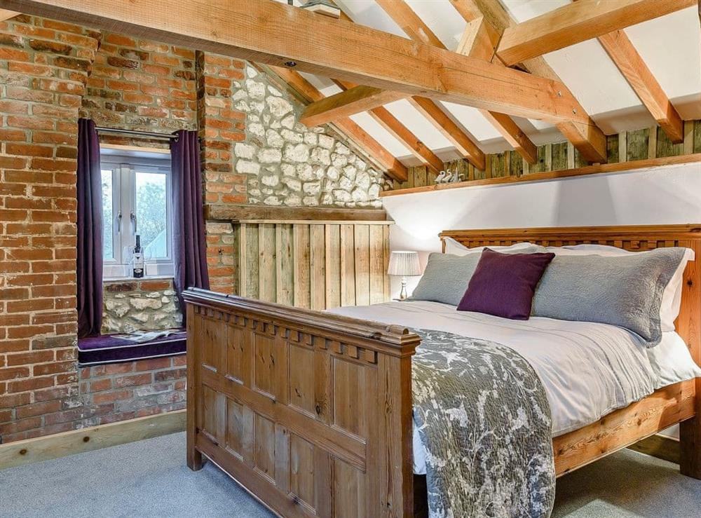 Relaxing double bedroom with beams at Honey Potts in Foulden, near Swaffham, Norfolk