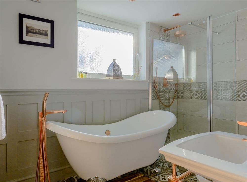 Bathroom with roll-top bath and separate shower at Honeycott in Llangattock, near Crickhowell, Powys