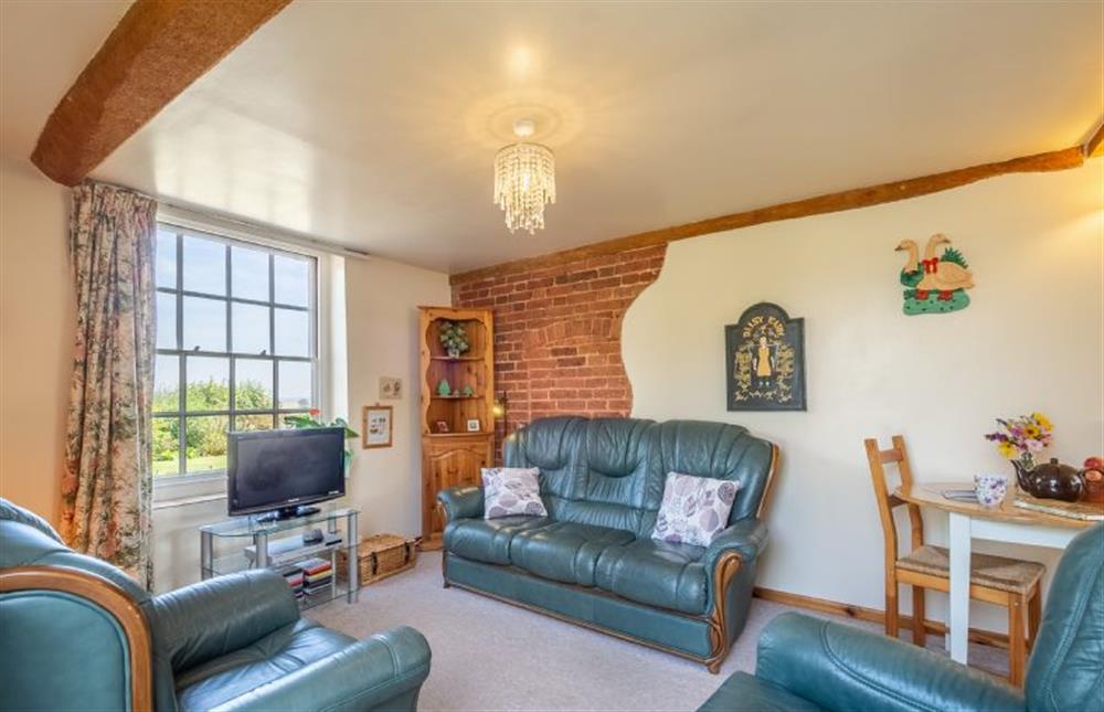 Cheerful sitting room at Honeypot Cottage, Falkenham
