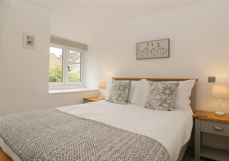 This is a bedroom at Honeypot Cottage, Shipton Gorge near Burton Bradstock
