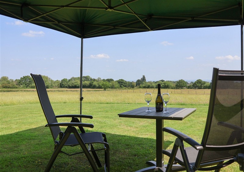 Enjoy a cup of tea on the patio at Honeypot Hideaways - Clover, Higher Kinnerton