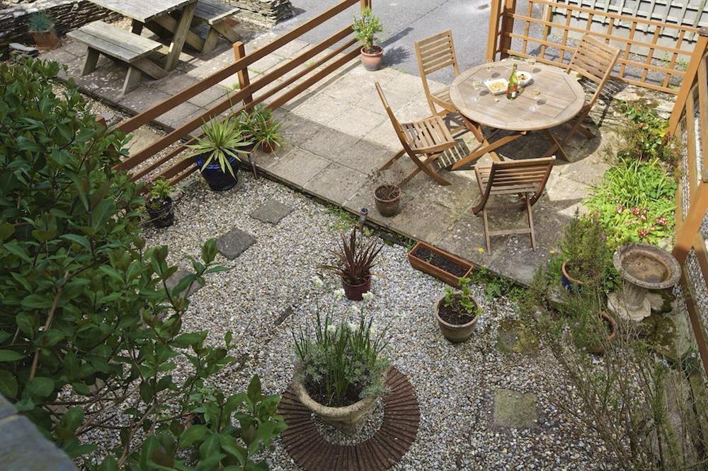 Cosy garden with table chairs and barbeque (photo 3) at Honeysuckle Cottage in Bigbury, Kingsbridge