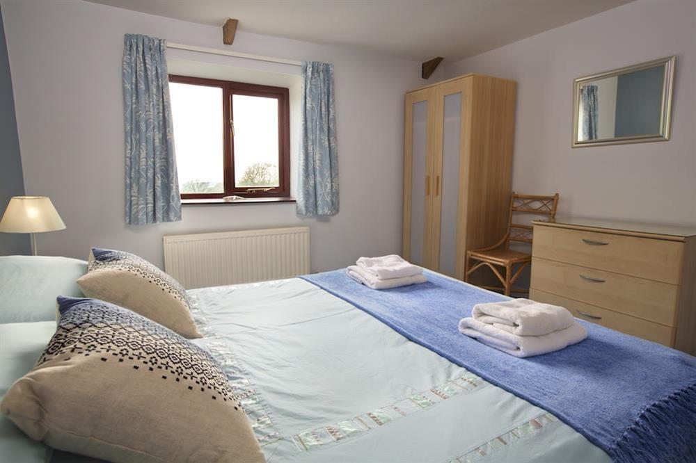 Master bedroom with King-size bed (photo 2) at Honeysuckle Cottage in Bigbury, Kingsbridge
