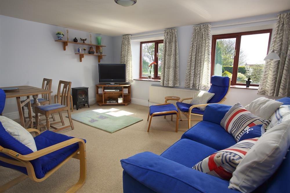 Spacious sitting room with flat screen TV at Honeysuckle Cottage in Bigbury, Kingsbridge