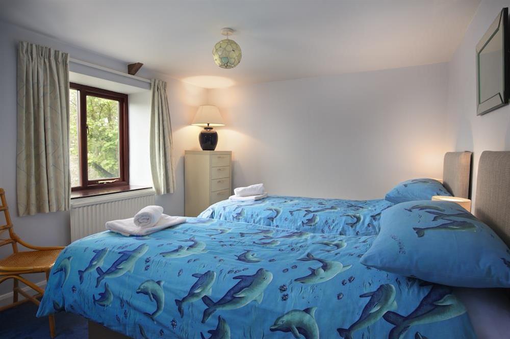 Twin bedroom with two new single beds at Honeysuckle Cottage in Bigbury, Kingsbridge