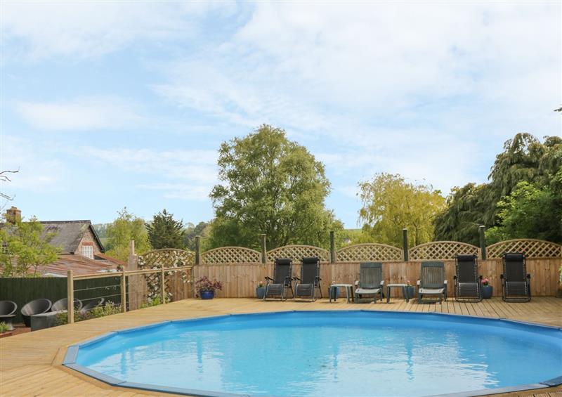 There is a swimming pool at Honeysuckle Cottage, Marldon