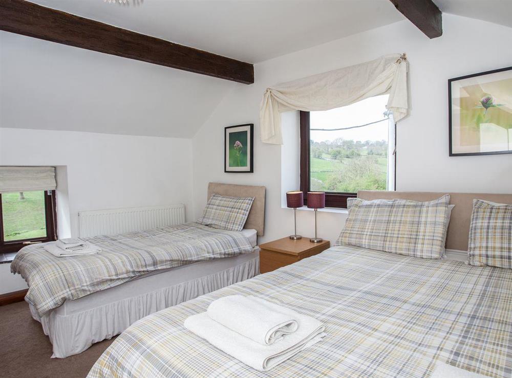 Double bedroom with additional single at Honeysuckle Cottage in Matlock, Derbyshire