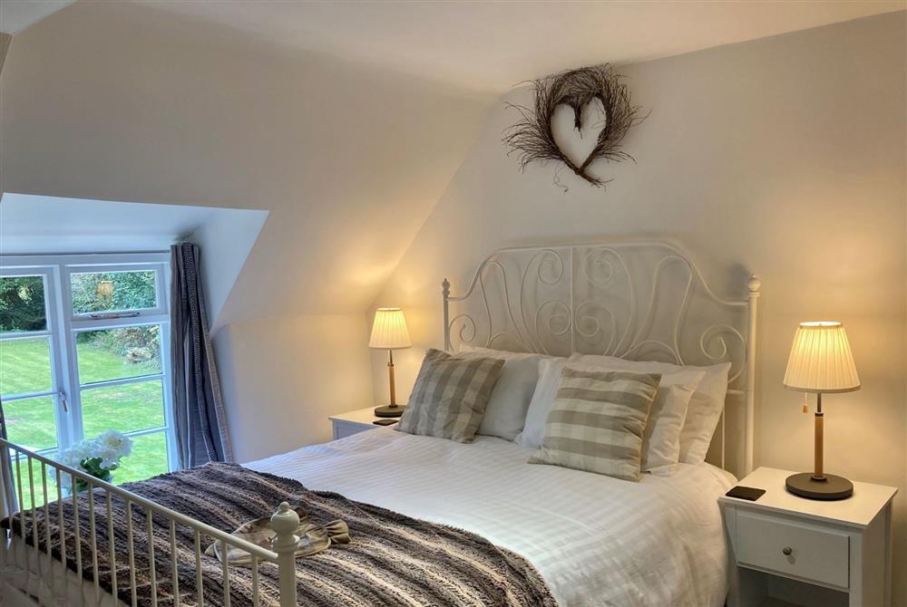 The cosy king-size bedroom at Honeysuckle Cottage, Moreton