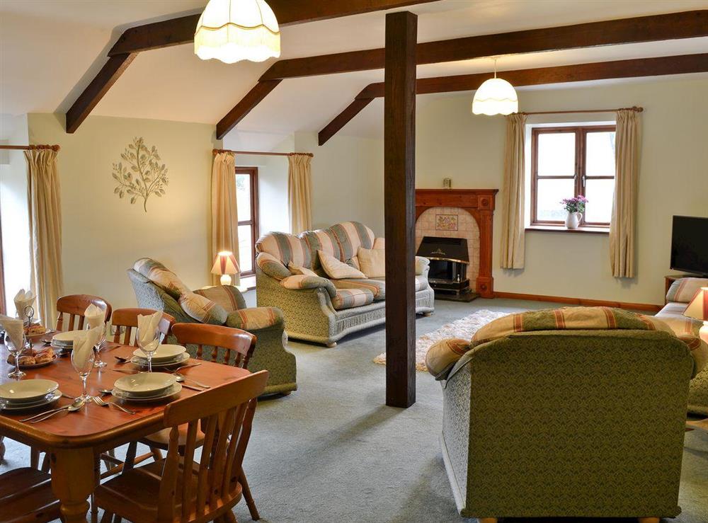 Living room & dining area at Honeysuckle Cottage in Nr. Newquay, Cornwall
