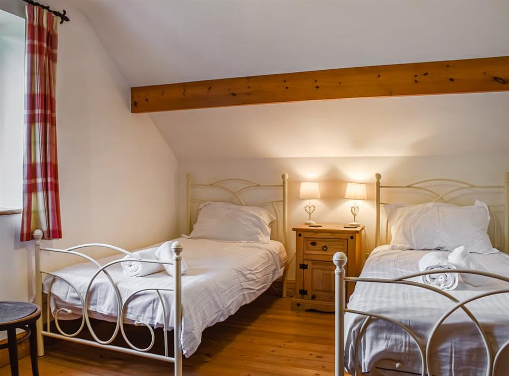 Twin bedroom at Honeysuckle Cottage in Pennard, West Glamorgan