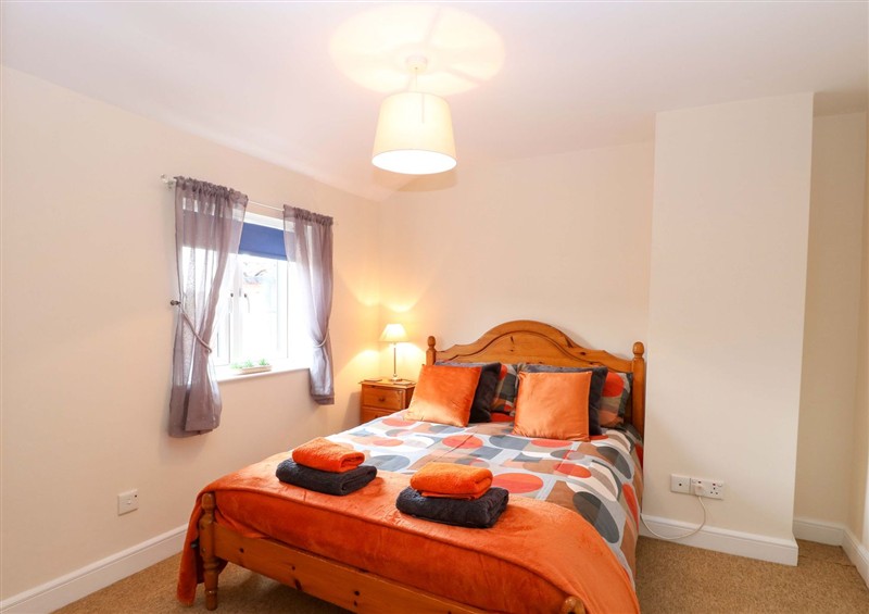 A bedroom in Honeysuckle Cottage at Honeysuckle Cottage, Swaffham