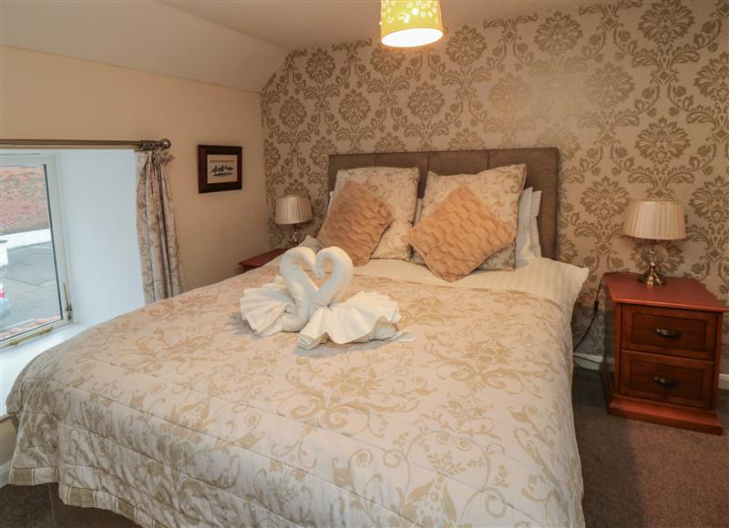 This is a bedroom at Honeysuckle, Filey