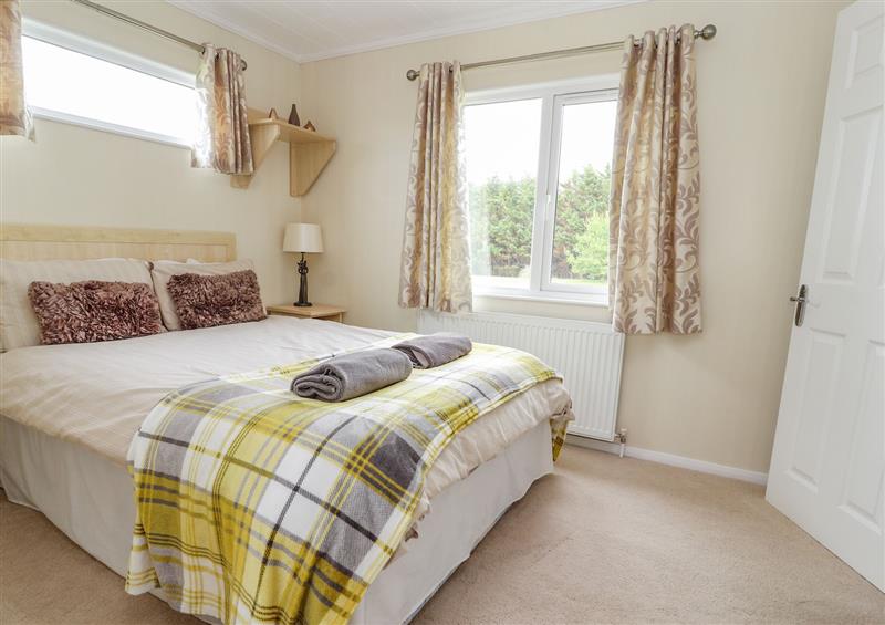 One of the 2 bedrooms at Honeysuckle Lodge, Towyn