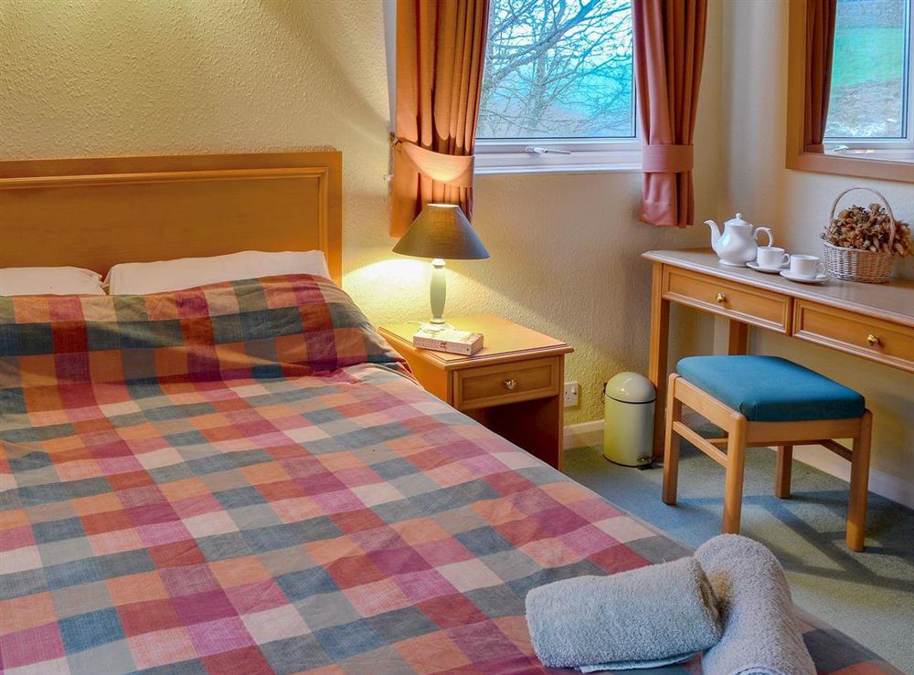 Comfy double bedroom (photo 2) at Honeysuckle Lodge in Woolfardisworthy, near Hartland, Devon