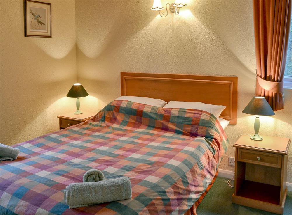 Comfy double bedroom at Honeysuckle Lodge in Woolfardisworthy, near Hartland, Devon